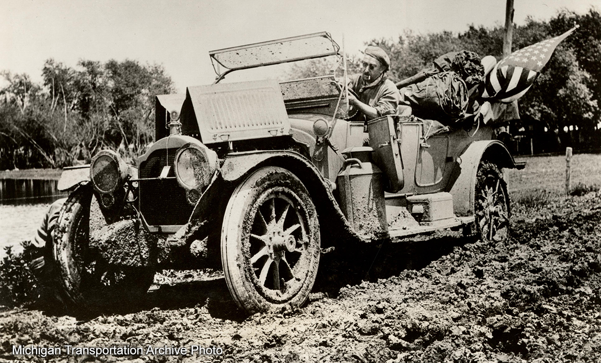 1st president of the Lincoln Highway Association Henry Joy in the mud (gumbo) - near La Mouille, Iowa June 1915.